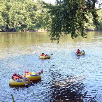 A group tubing down the San Marcos river