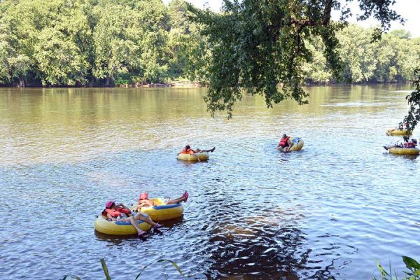 A group tubing down the San Marcos river