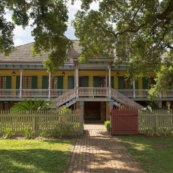 Yellow two story home for sale