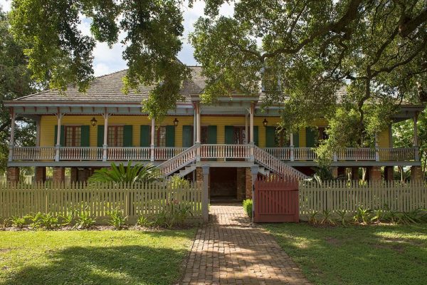 Yellow two story home for sale