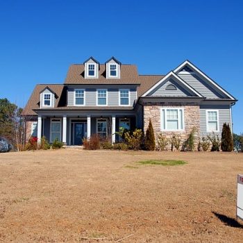 Two story brick and sky blue home for sale