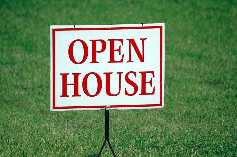 San Marcos real estate open house sign on green lawn