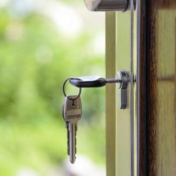 A key opening a home's front door