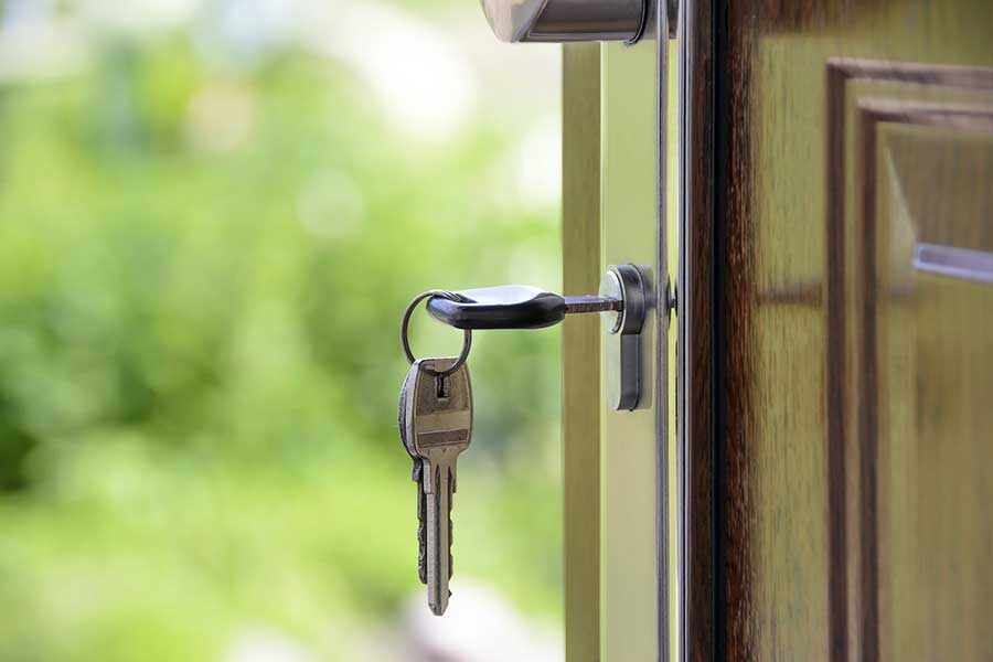 A key opening a home's front door