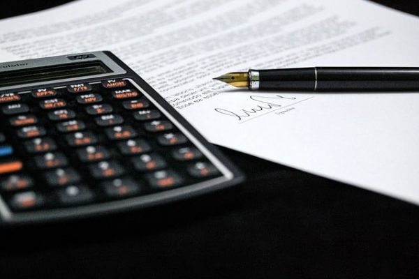 Calculator alongside signed document