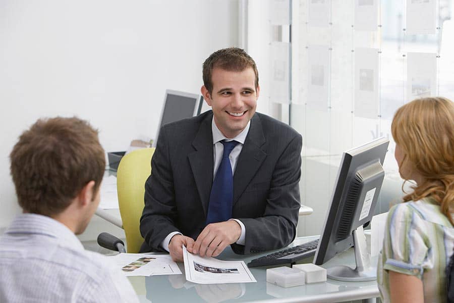 Couple happy with Real Estate Agent