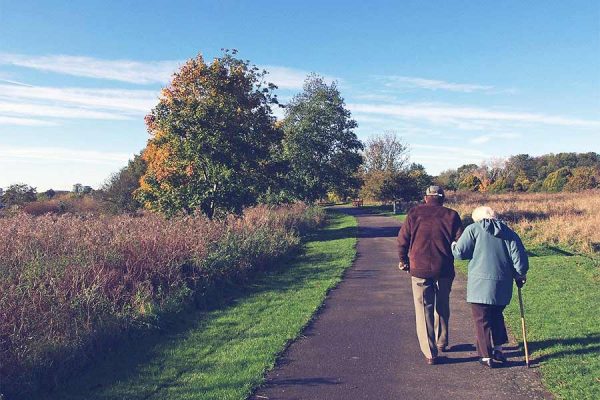 A retired couple enjoying a leisurely walk