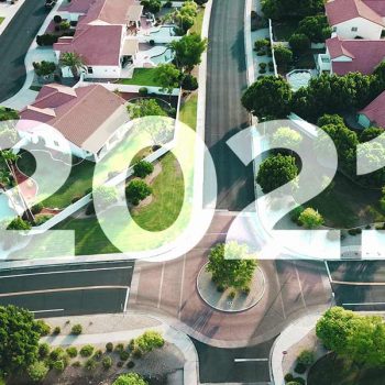 The text "2021" overlaid on an aerial shot of houses