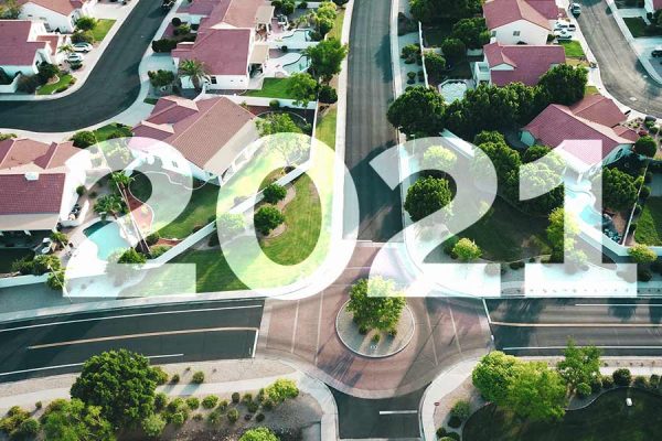 The text "2021" overlaid on an aerial shot of houses