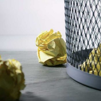 waste basket with crumpled up offers