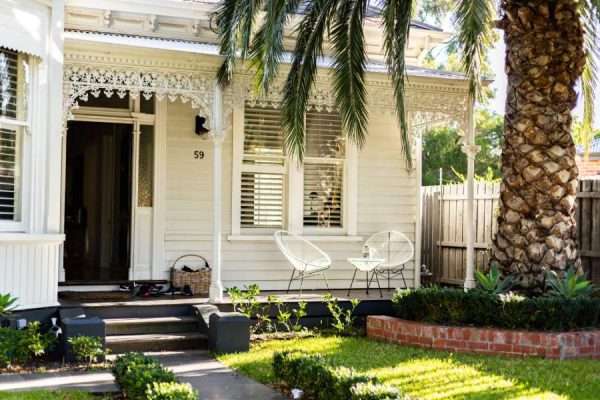 victorian house with beautiful white porch - sell your house real estate in San Marcos Tx