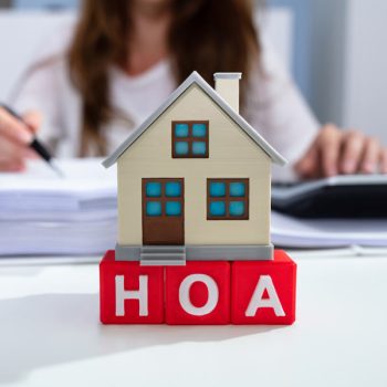 Close-up of house models on blocks with letters HOA