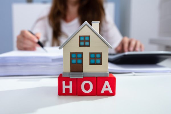 Close-up of house models on blocks with letters HOA